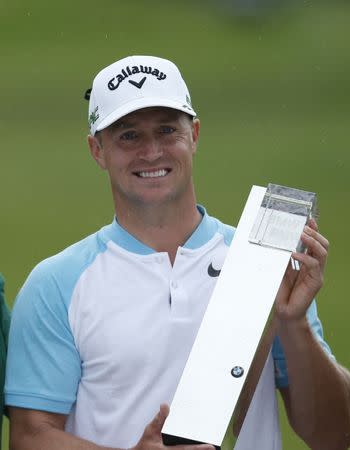 Britain Golf - BMW PGA Championship - Wentworth Club, Virginia Water, Surrey, England - 28/5/17 Sweden's Alex Noren celebrates winning the BMW PGA Championship with the trophy Action Images via Reuters / Paul Childs Livepic