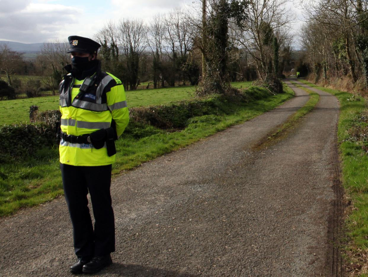 <p>Garda at the scene near Curraghgorm, County Cork, following the deaths of three brothers.</p> (PA)