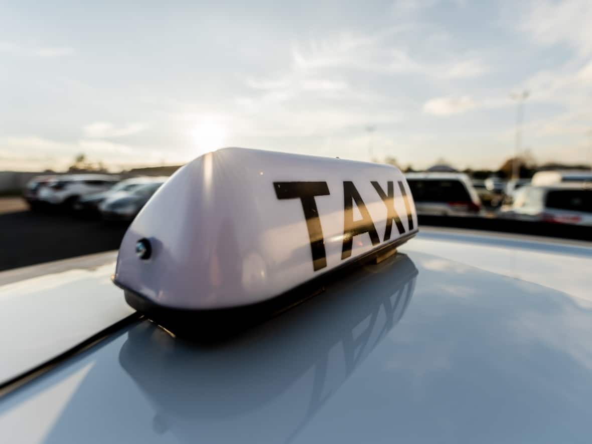 Stock image of a taxi. Richmond RCMP are warning people to be on the lookout for a white Toyota Camry with a white taxi sign on the roof that they say is part of a scam operation currently happening in the city. (Shutterstock / WATCH_MEDIA_HOUSE - image credit)