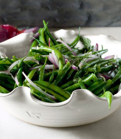 <p>Kick simple green beans up a notch with the help of Dijon mustard, onions, garlic, and lemon. </p><p>Get the <strong><a href="https://www.womansday.com/food-recipes/food-drinks/recipes/a37876/green-bean-salad-red-onions-recipe-clx1111/" rel="nofollow noopener" target="_blank" data-ylk="slk:Green Bean Salad with Red Onions recipe;elm:context_link;itc:0;sec:content-canvas" class="link ">Green Bean Salad with Red Onions recipe</a></strong>. </p>