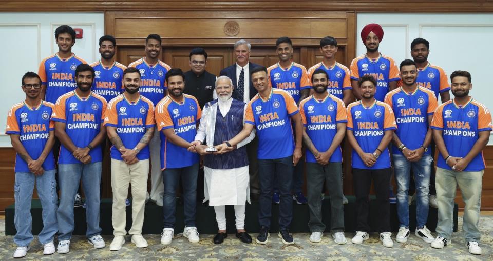 In this images shared on X by the official page of the Indian Prime Minister Narendra Modi, Modi holds the Twenty20 World Cup trophy as he poses with the Indian cricket team at his residence in New Delhi, India, Thursday, July 4, 2024. Jubilant India cricketers received a rousing welcome home Thursday after winning the Twenty20 World Cup final in Barbados. (Narendra Modi on X via AP)