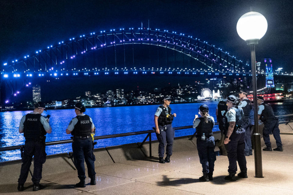 Police are seen at the Sydney Opera House during New Year's Eve celebrations on December 31, 2020.