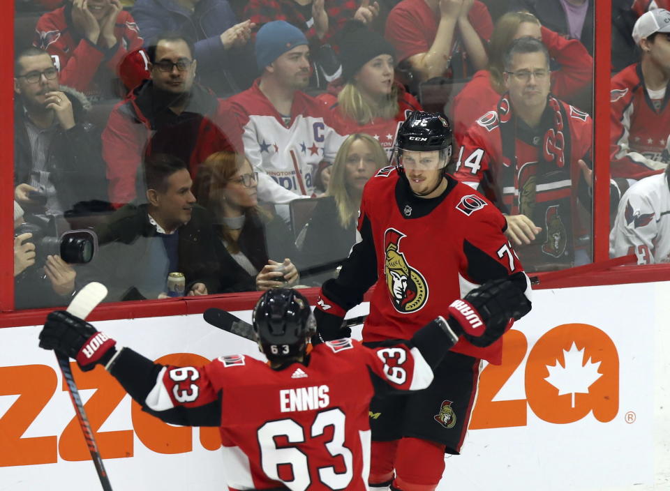 Ottawa Senators defenseman Thomas Chabot (72) celebrates his goal against the Washington Capitals with right wing Tyler Ennis (63) during the second period of an NHL hockey game Friday, Jan. 31, 2020, in Ottawa, Ontario. (Fred Chartrand/The Canadian Press via AP)