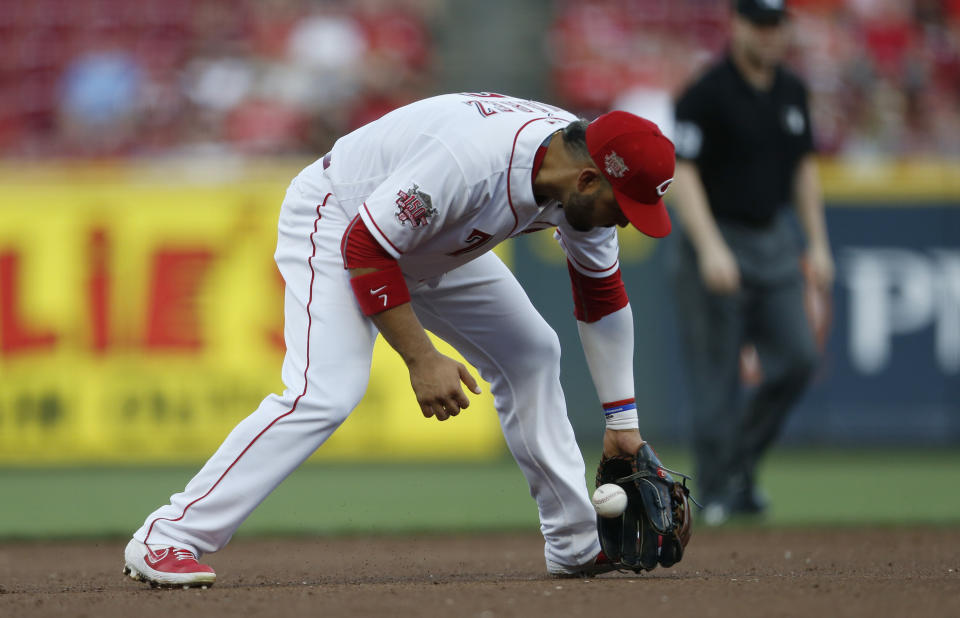 Cincinnati Reds third baseman Eugenio Suarez (7) fields a ground ball off the bat of Milwaukee Brewers Lorenzo Cain during the fourth inning of a baseball game, Monday, July 1, 2019, in Cincinnati. (AP Photo/Gary Landers)