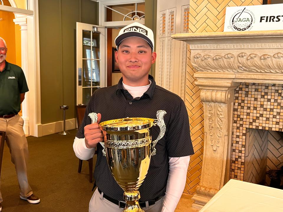Kent Hsaio of Purdue displays the trophy for winning the eighth annual First Coast Amateur on Monday, at the Amelia National Golf Club. Purdue golfers have won the tournament three times.