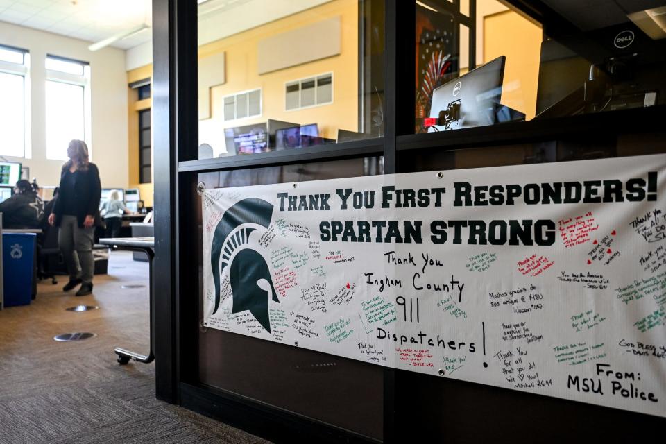 A banner from MSU Police thanking the Ingham County 911 operators for their work during the Michigan State University shooting hangs at Ingham County's 911 Center on Wednesday, April 26, 2023, in Lansing.