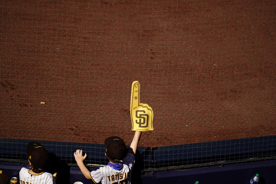 A San Diego Padres fan looks on as the Padres play the Los Angeles Dodgers in a baseball game Sunday, April 18, 2021, in San Diego. (AP Photo/Gregory Bull)