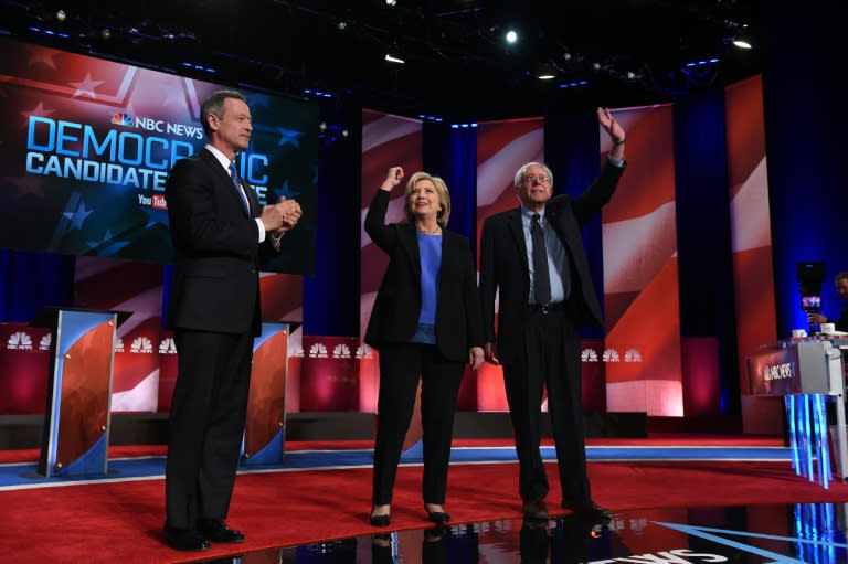 Democratic presidential candidates, former Maryland governor Martin O'Malley (L), former Secretary of State Hillary Clinton (C), and Vermont Senator Bernie Sanders (R) arrive on stage for the debate on January 17, 2016 in Charleston, South Carolina