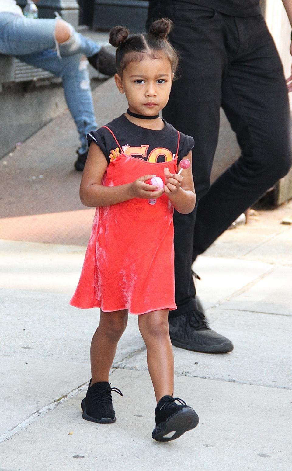 <p>North’s clashing enemble makes her look like a rockstar. She must have gotten ready with Kendall that morning. (Photo: Backgrid) </p>