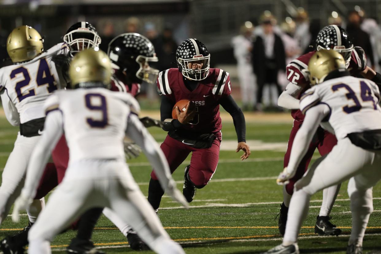 Evan Garvin from Elmira looks for running room against the CBA defense in CBA's 49-20 victory in a NYSPHSAA Class AA quarterfinal Nov. 18, 2023 at Vestal.