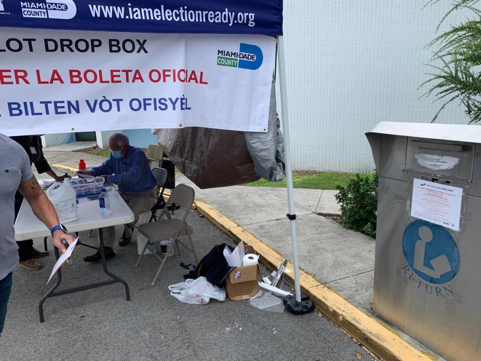 This is an early voting location’s drop-off box tent at the Kendall Branch Library on Oct. 22, 2020. But note that the box in the far right is the library’s book drop-off box. Do not drop your election ballot into the book return box by mistake.