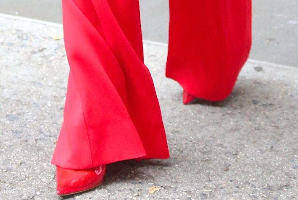 A closer look at her glossy red patent leather pumps featuring a timeless pointed toe. - Credit: Splash News