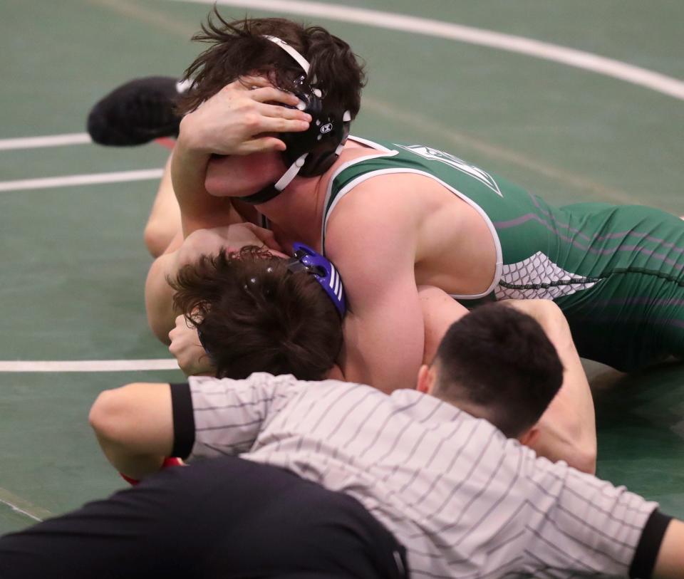 Delaware Military's Ethan MacDonnell (bottom) fights off a pin before falling 6-5 to Archmere's Michael Ciampoli for the Auks' only points in Delaware Military Academy's 74-3 win Friday, Feb. 3, 2023 at Archmere Academy.