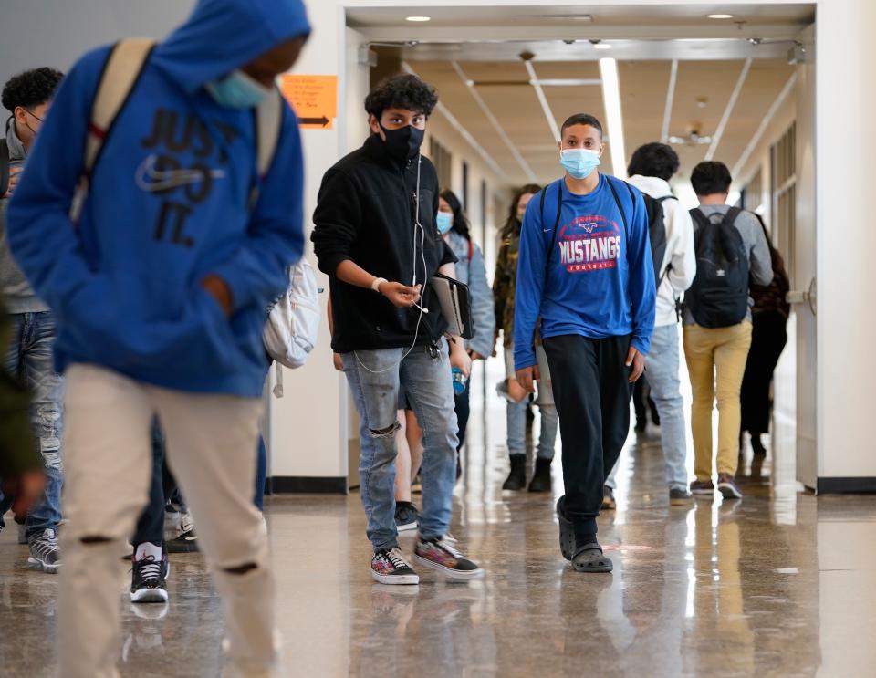 Students return to West Mesa High School on the second day of full-time, in-person classes. Most of the school's 1,757 students chose to stay remote, but 495 returned in person.