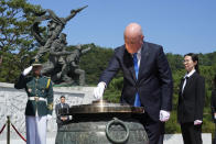 New Zealand's Prime Minister Christopher Luxon burns incense during a visit to National Cemetery in Seoul, South Korea, Wednesday, Sept. 4, 2024. (AP Photo/Ahn Young-joon)