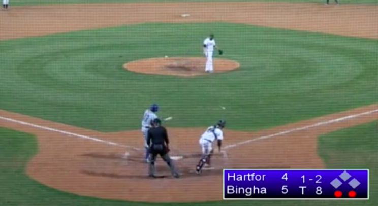 The ball is in the grass, but the batter is mid-swing. (Screenshot via @Cut4)