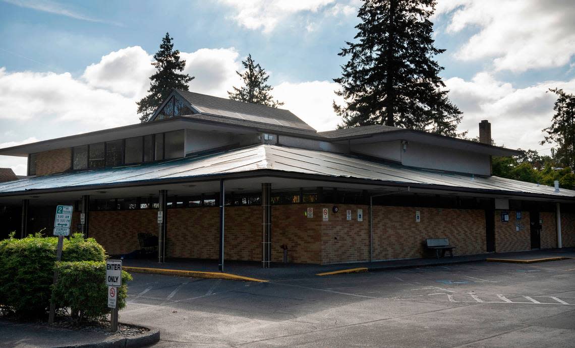 Tarps cover portions of the roof of the Lakewood Pierce County Library in Lakewood, Washington, which has been closed since June due to the need for major repairs. The building is shown on Saturday, Sept. 24, 2022.