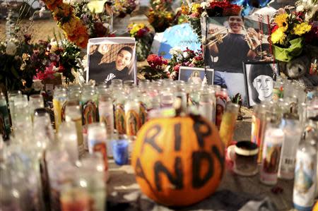 Candles and photographs form a memorial in a vacant lot where 13-year-old Andy Lopez Cruz was shot and killed by sheriff's deputies on Tuesday in Santa Rosa, California October 27, 2013. REUTERS/Noah Berger
