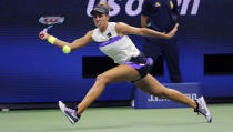 FILE - In this Aug. 30, 2019, file photo, Madison Keys chases the ball on a return to Sofia Kenin during the third round of the U.S. Open tennis championships, in New York. Keys will be competing in the Australian Open tennis tournament, beginning Monday, Jan. 20, 2020.(AP Photo/Charles Krupa, File)