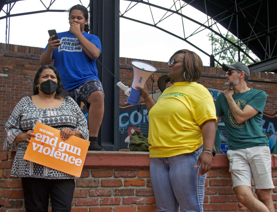 Ashoka Banerjee (second from left) speaks before March For Our Lives participants took to the streets of downtown Gainesville, traveling from Bo Diddley Plaza to Depot Park on Saturday. “It will take all of us to stop this. Let’s march, let’s mourn, but most importantly let’s vote against the gun law lobby and the politicians who arm the child killers,” said Banerjee.