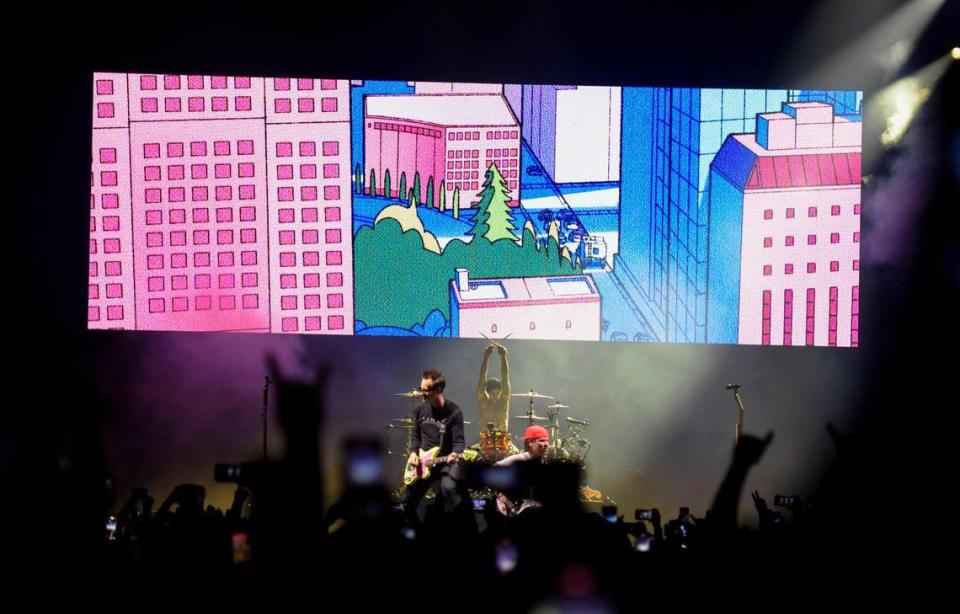 Blink 182 band members, from left to right, Mark Hoppus, Travis Barker and Tom DeLong perform at Spectrum Center arena on Friday, July 14, 2023, during the band’s world tour.