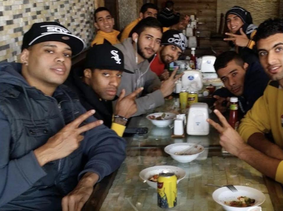 Joel Box (far left) poses for a picture at a dinner with some of his Iraqi teammates. (Photo via Joel Box)