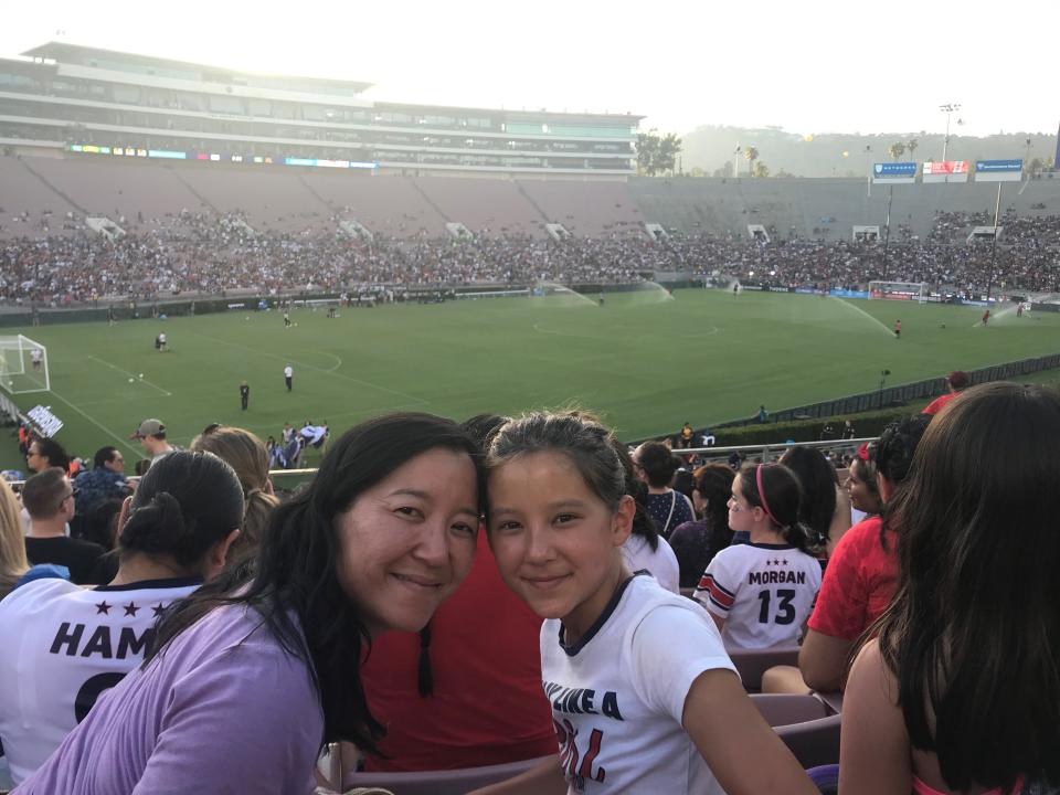 Aimee Phan and daughter attend a USWNT exhibition game at the Rose Bowl in Pasadena, Calif., in 2019 after the team won the World Cup.