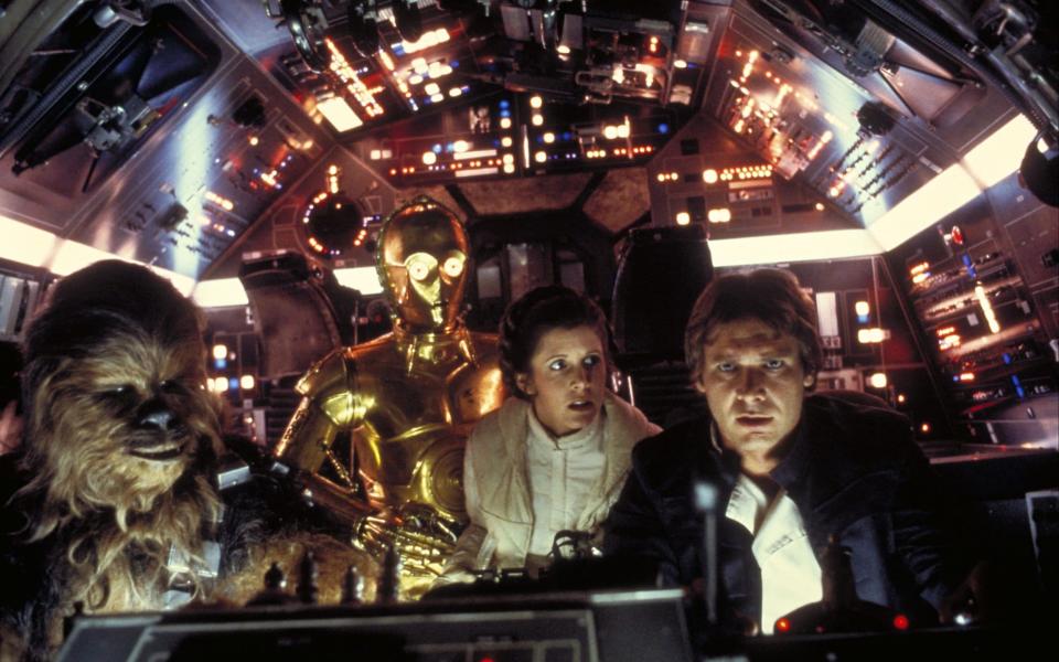 Carrie Fisher (second right) and Harrison Ford (first right) fly to Cloud City, in a scene from Star Wars: The Empire Strikes Back (1980) - Film Stills