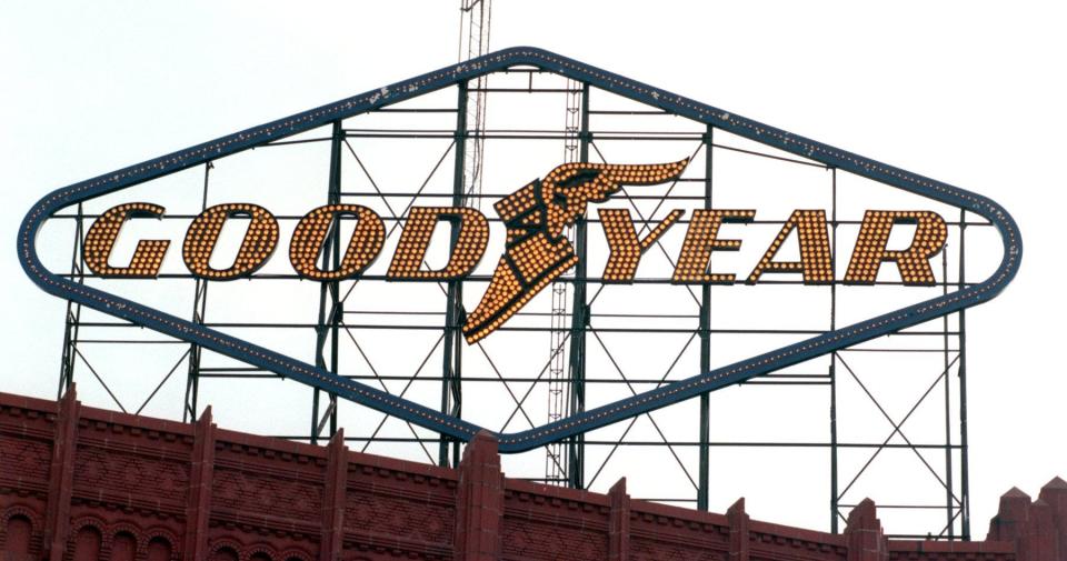 The Goodyear sign glows in the 1990s over Goodyear Hall on East Market Street in Akron. The famous sign has been restored and will shine again after nearly a decade.