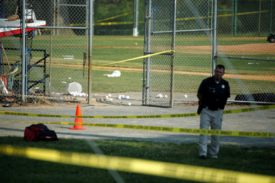 A police officer mans a shooting scene.