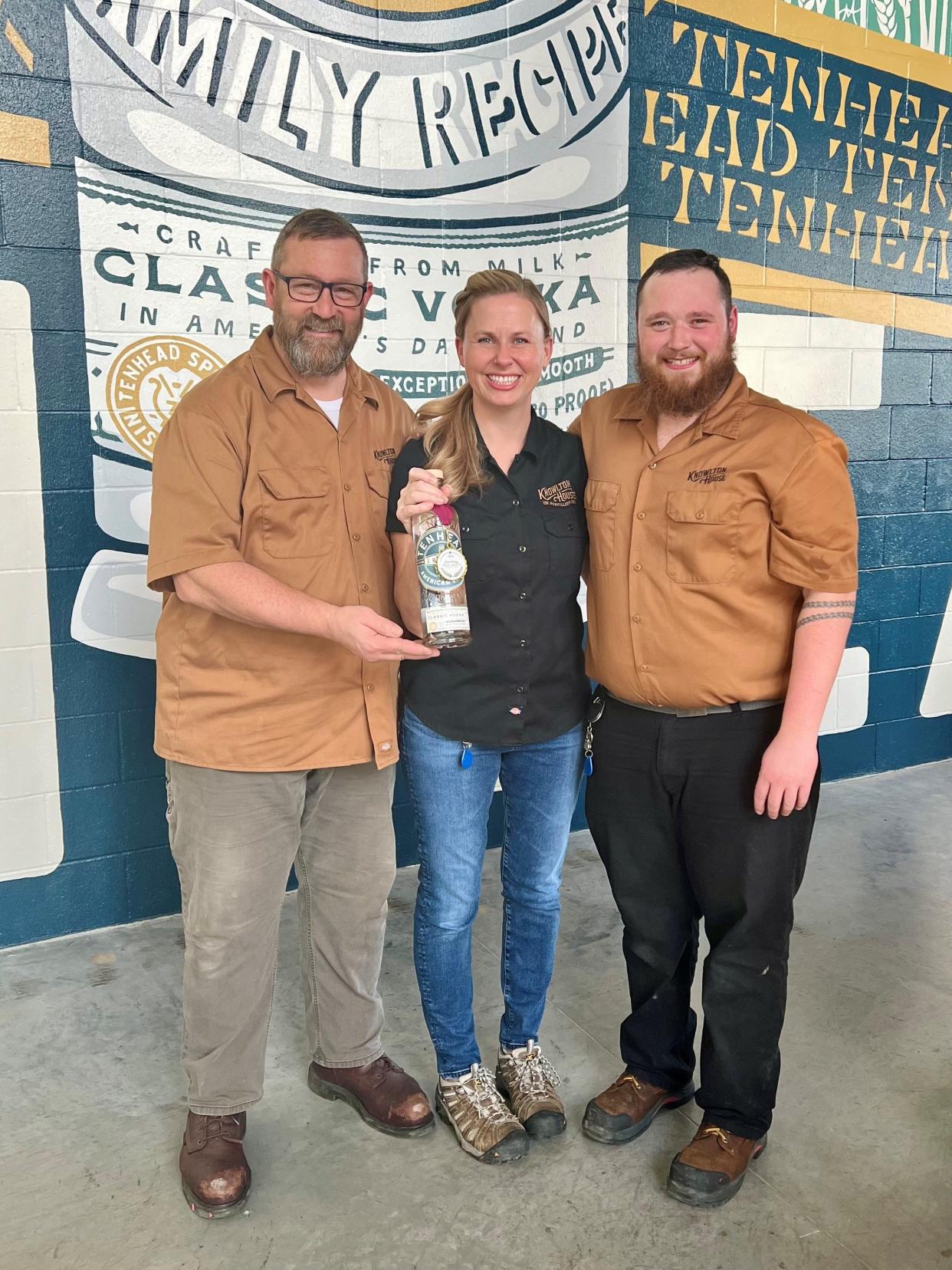 Heather Mullins, co-founder and head distiller at Knowlton House Distillery, stands with distilling team members David Ley and Takoda Millonig.