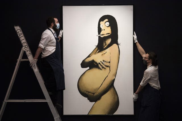 Gallery technicians with Original Concept for Barely Legal Poster (after Demi Moore) by Banksy