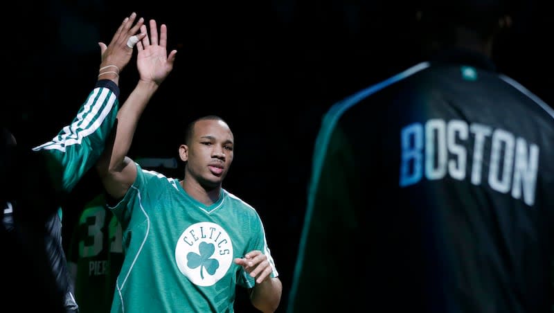 Boston Celtics guard Avery Bradley high-fives a teammate as he is introduced prior to an NBA basketball game in Boston, Wednesday, Jan. 2, 2013.