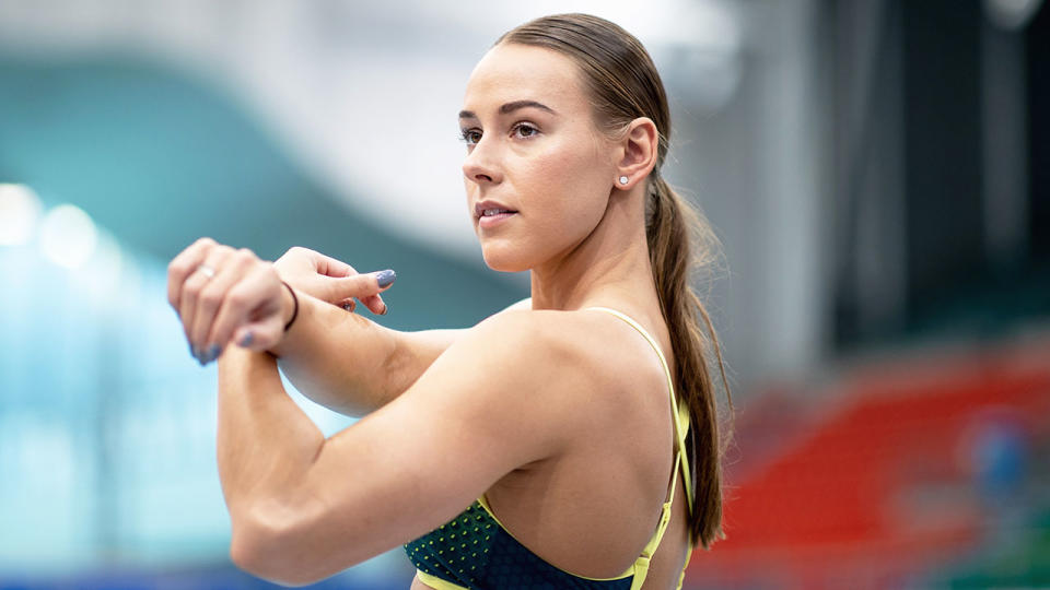 Pictured here, Australian swimmer Brianna Throssell stretches before a race.