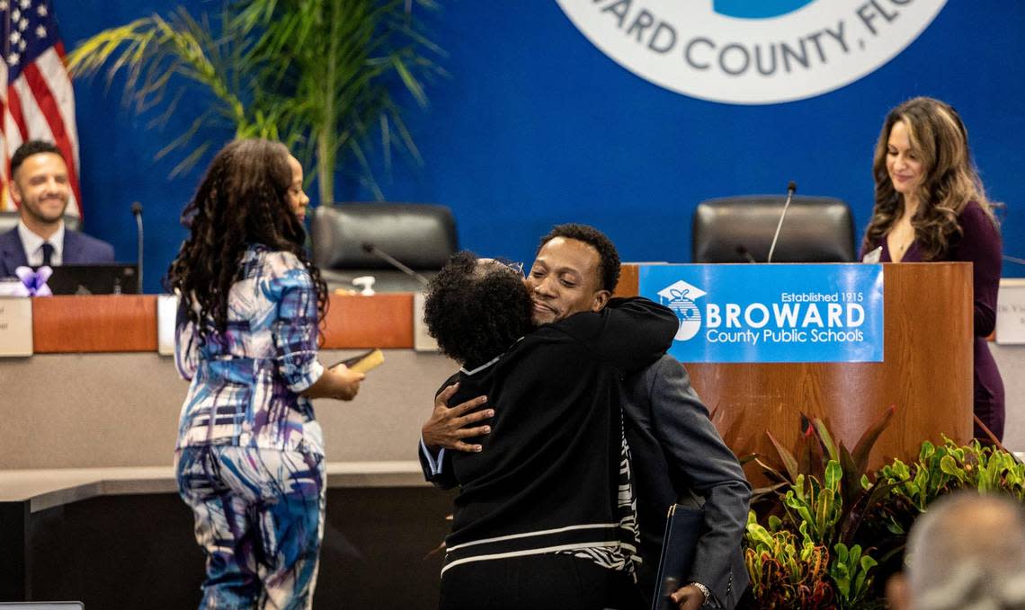 Torey Alston, District 2, hugs Dr. Earlean Smiley before she swore him in to the Broward School Board on Aug. 30, 2022.