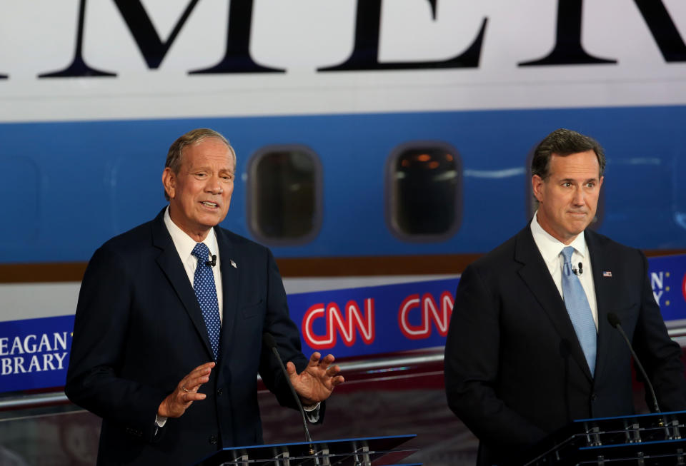 Republican presidential candidates George Pataki (L) and Rick Santorum take part in the presidential debates at the Reagan Library on Sept. 16, 2015, in Simi Valley, California. Fifteen Republican presidential candidates are participating in the second set of Republican presidential debates.