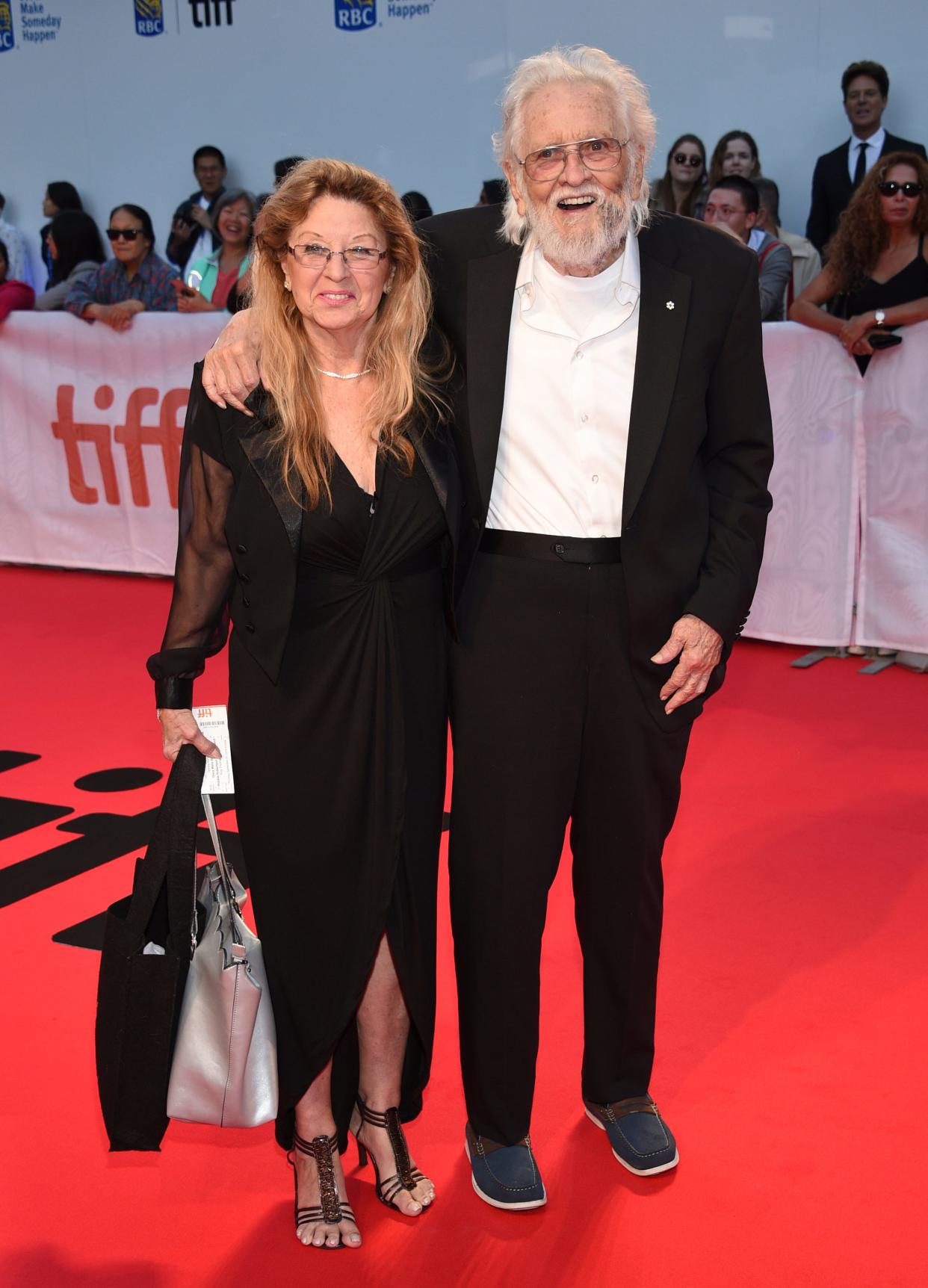 FILE - Ronnie Hawkins, right, and Wanda Hawkins attend the premiere for "Once Were Brothers: Robbie Robertson and The Band," on Day 1 of the Toronto International Film Festival at the Roy Thomson Hall on Thursday, Sept. 5, 2019, in Toronto. Ronnie Hawkins, a brash rockabilly star from Arkansas who became a patron of the Canadian music scene after moving north and recruiting a handful of local musicians later known as the Band, died Sunday, May 29, 2022. He was 87. (Photo by Evan Agostini/Invision/AP, File)