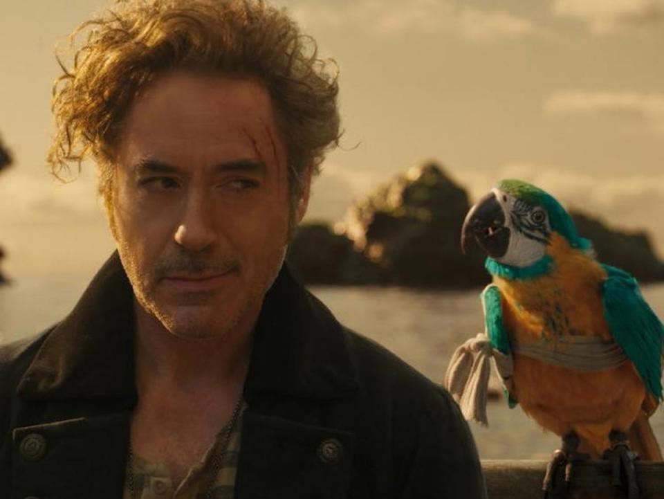 Robert Downey Jr as Dr John Dolittle alongside a talking parrot voiced by Emma Thompson (Universal Pictures)