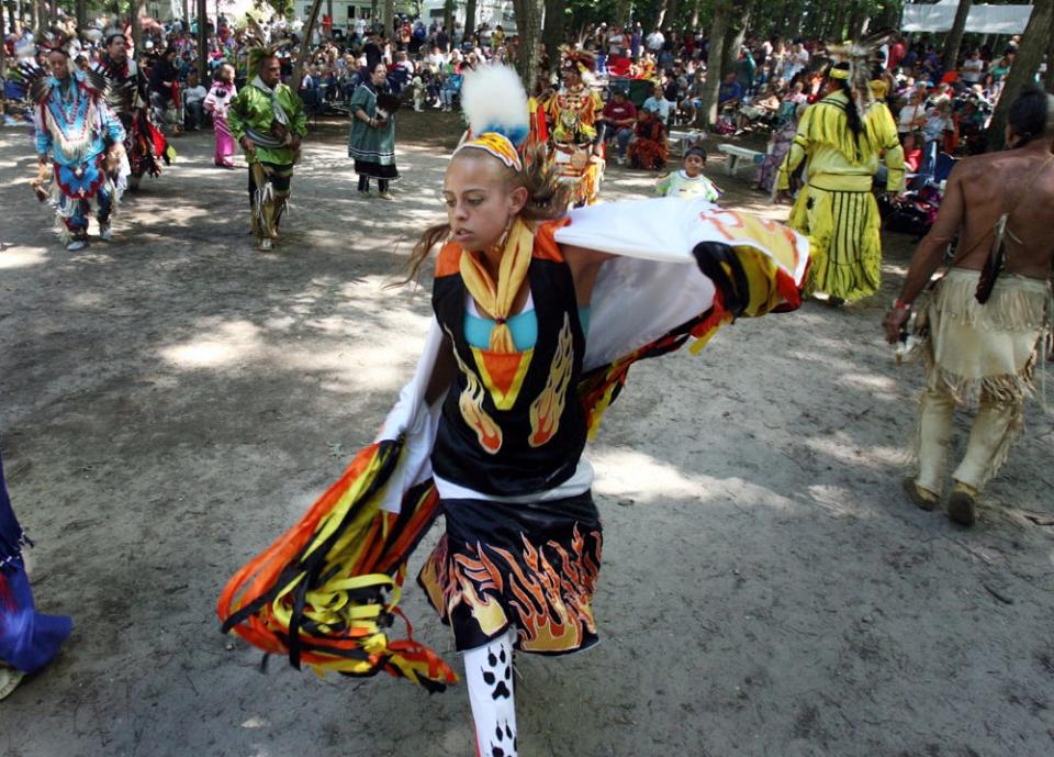 Carissa Miller of Millsboro, a member of the Nanticoke Tribe, performs a fancy dance during an inter-tribal dance at the 36th annual Nanticoke Indian Powwow near Millsboro.