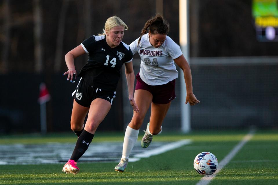 West Ottawa's Jillian Garcia fights for the ball against Holland Christian's Tianna Stygstra Friday, April 14, 2023, at West Ottawa High School. 