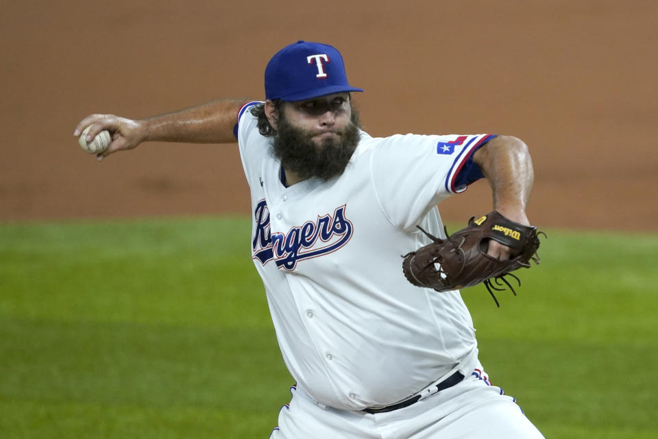 Texas Rangers starting pitcher Lance Lynn throws to the Oakland Athletics in the first inning of a baseball game in Arlington, Texas, Monday, Aug. 24, 2020. (AP Photo/Tony Gutierrez)