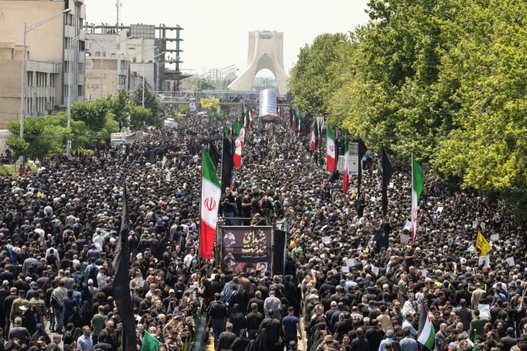 Mourners throng the streets of Tehran for the funeral (-)