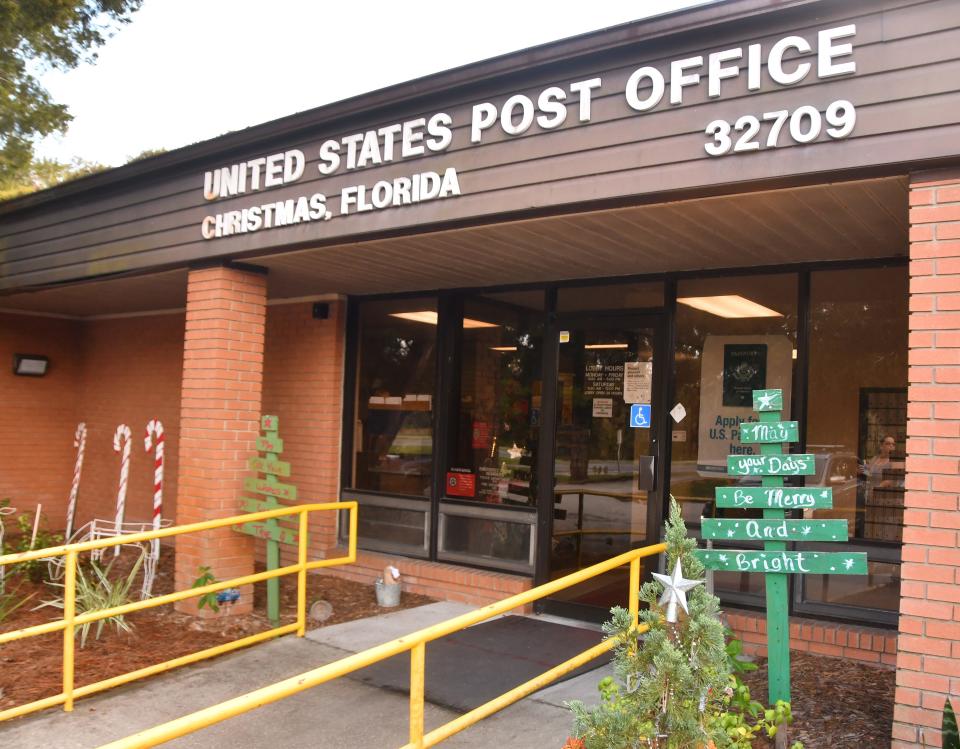 The Christmas post office is decorated with holiday decorations. 