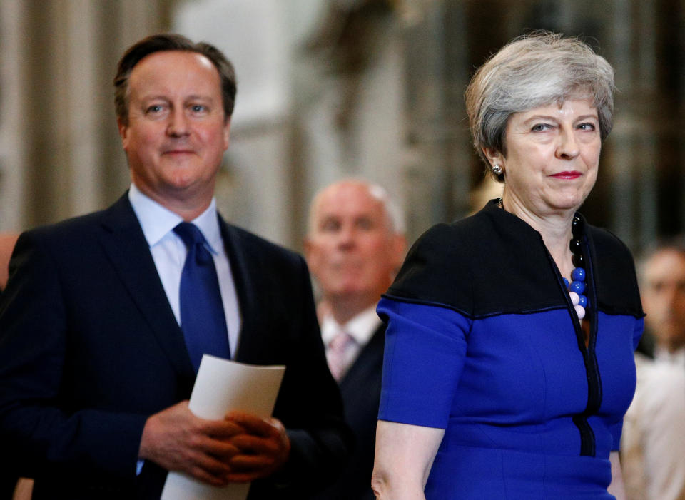 Prime Minister Theresa May and her predecessor David Cameron during a service of thanksgiving for the life and work of former Cabinet Secretary Lord Heywood at Westminster Abbey in London.