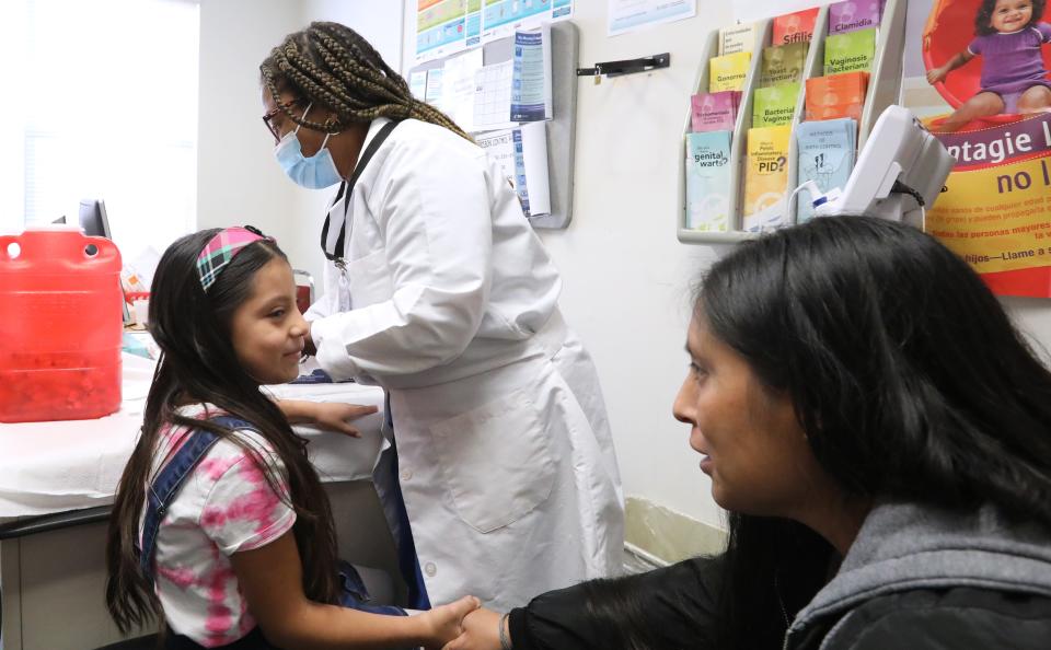 Anyelyn Lorenzo Maldonado with her mother, Mirna Maldonado, got vaccinations from nurse Bernadette Fontanges at the Rockland County Department of Health satellite vaccination clinic in Spring Valley Oct. 19, 2023.