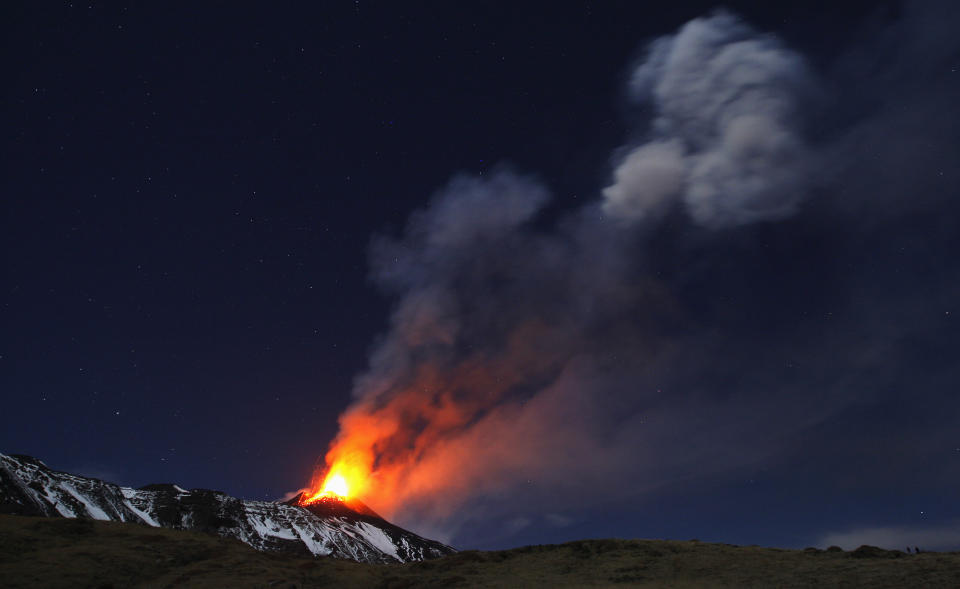 Italy's Mount Etna, Europe's tallest and most active volcano, spews lava as it erupts on the southern island of Sicily November 16, 2013. There were no reports of damage or evacuations in the area and the nearby airport of Catania was operating as normal, local media reported. It is the 16th time that Etna has erupted in 2013. The south-eastern crater, formed in 1971, has been the most active in recent years. Picture taken November 16, 2013.   REUTERS/Antonio Parrinello (ITALY - Tags: ENVIRONMENT SOCIETY TPX IMAGES OF THE DAY)
