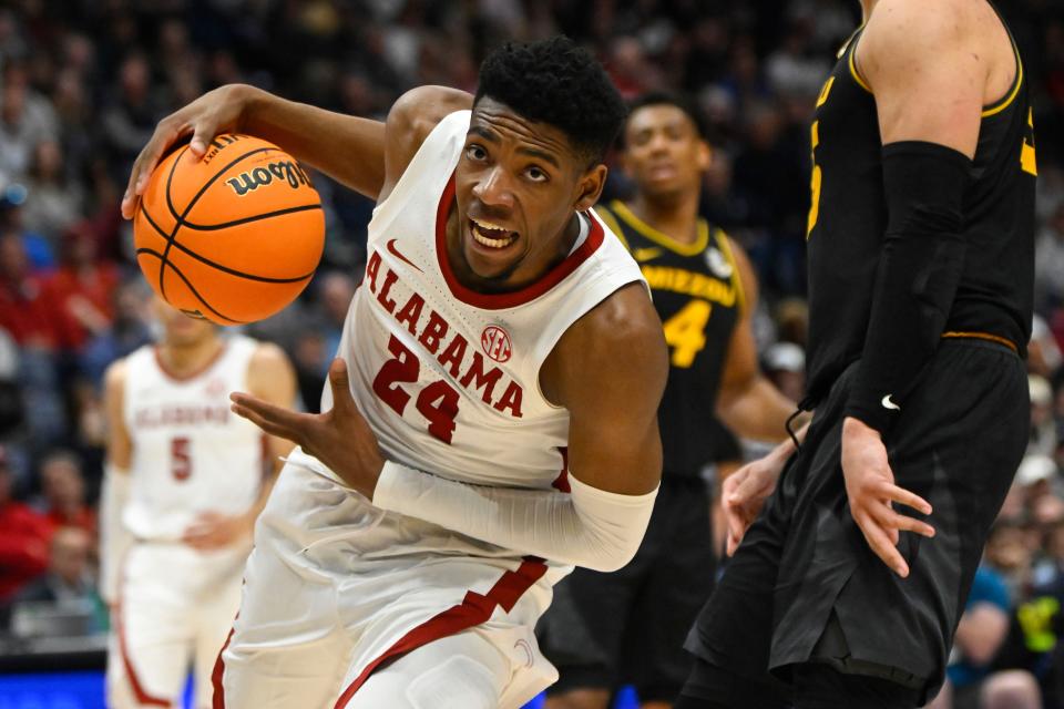 FILE - Alabama forward Brandon Miller, left, drives into the lane during the second half of an NCAA college basketball game against Missouri in the semifinals of the Southeastern Conference Tournament, March 11, 2023, in Nashville, Tenn. Miller is among the top forwards in the upcoming NBA draft. (AP Photo/John Amis, File)