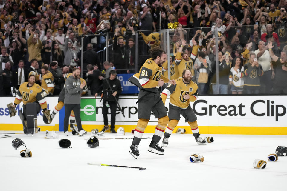 Members of the Vegas Golden Knights, including right wing Mark Stone (61) celebrate after they defeated the Florida Panthers 9-3 to win the Stanley Cup in Game 5 of the NHL hockey Stanley Cup Finals Tuesday, June 13, 2023, in Las Vegas. (AP Photo/John Locher)