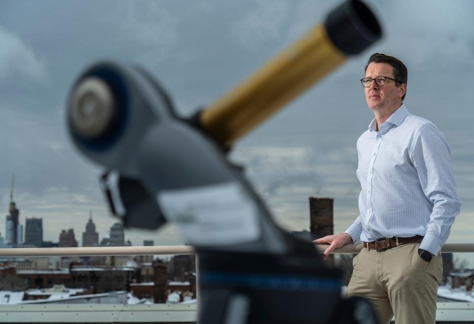 Wayne State University department of physics and astronomy professor and chair Ed Cackett stands with a solar telescope on the roof of the Physics Building at the Detroit campus on Friday, March 22, 2024.