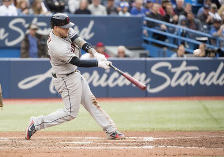 Sep 8, 2018; Toronto, Ontario, CAN; Cleveland Indians catcher Roberto Perez (55) hits a three run double during the fifth inning against the Toronto Blue Jays at Rogers Centre. Mandatory Credit: Nick Turchiaro-USA TODAY Sports